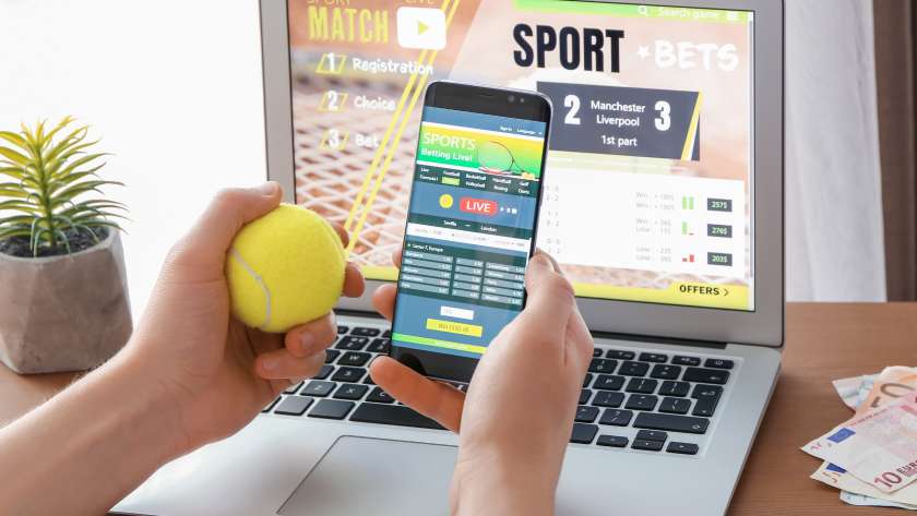 Man Placing Sports Bet at Home